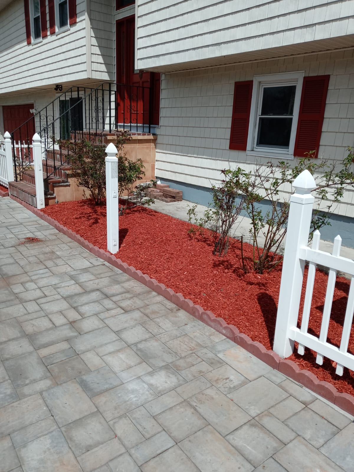 After — fresh red mulch and clean edging